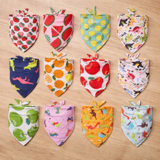Collection of colorful bandanas with various patterns on a wooden surface