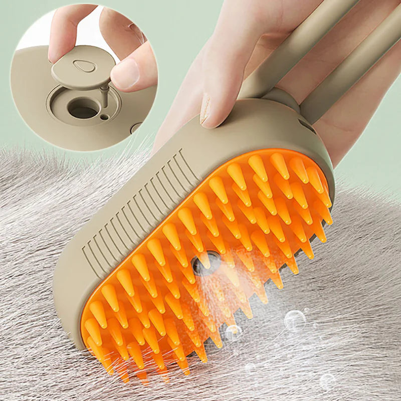 Pet grooming brush with orange bristles being used on a surface, with a close-up inset showing the brush head.